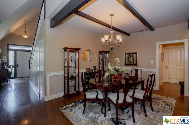 dining area with dark hardwood / wood-style flooring, beamed ceiling, and an inviting chandelier