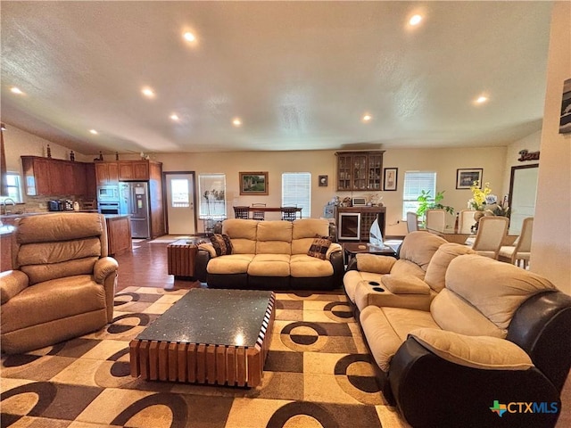 174 Riley Ln, Port Oconnor, TX 77982 - living area featuring recessed lighting, healthy amount of natural light, and vaulted ceiling