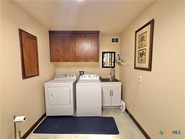 174 Riley Ln, Port Oconnor, TX 77982 - laundry room featuring washer and clothes dryer, cabinet space, baseboards, and light colored carpet