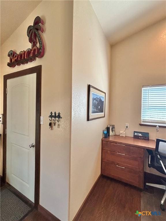 174 Riley Ln, Port Oconnor, TX 77982 - office area featuring dark wood-style flooring and baseboards