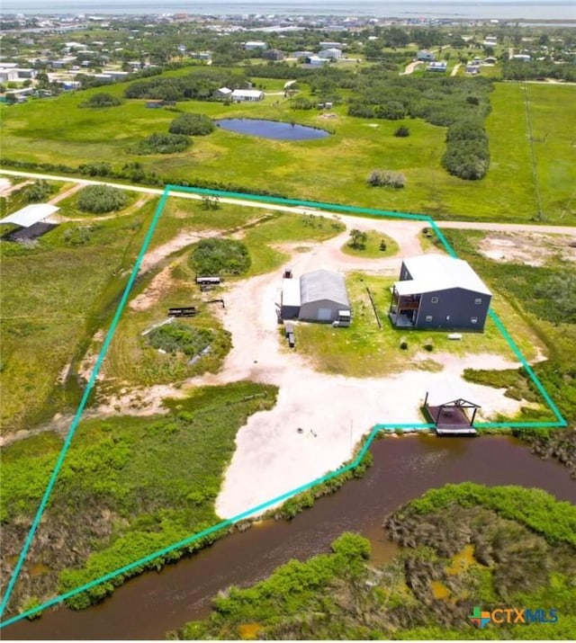 174 Riley Ln, Port Oconnor, TX 77982 - aerial view of property and surrounding area featuring a large body of water and property boundaries highlighted