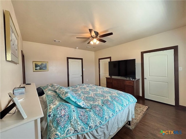 174 Riley Ln, Port Oconnor, TX 77982 - bedroom featuring dark wood-style flooring and a ceiling fan