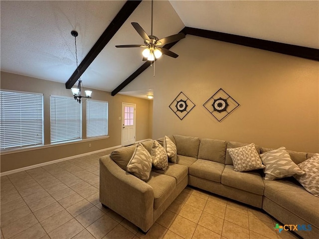 tiled living room with a textured ceiling, beam ceiling, ceiling fan with notable chandelier, and high vaulted ceiling