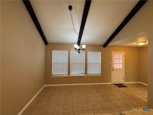 interior space with a textured ceiling, light tile patterned floors, a chandelier, and lofted ceiling with beams