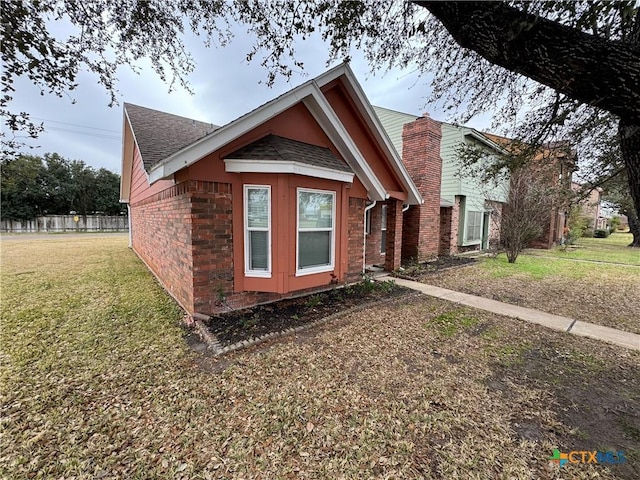 bungalow-style house with a front yard