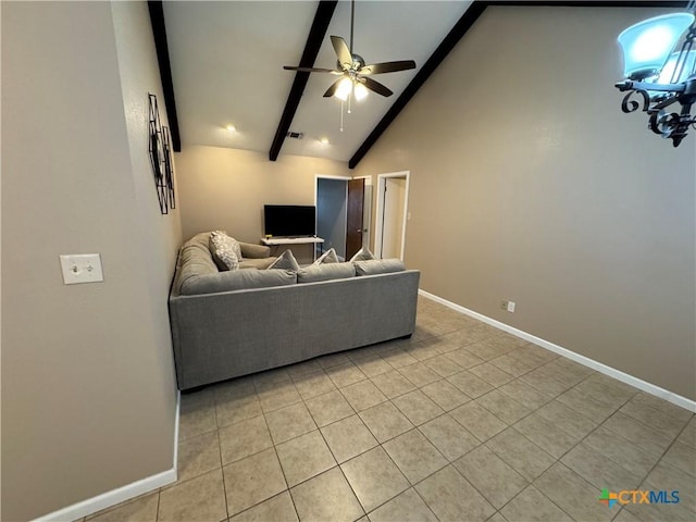 living room featuring ceiling fan, light tile patterned flooring, and vaulted ceiling with beams