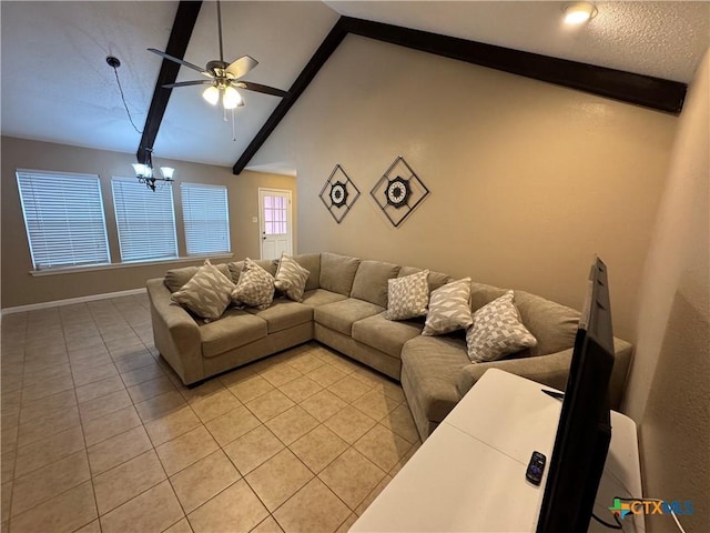 living room with light tile patterned floors, ceiling fan with notable chandelier, and vaulted ceiling with beams