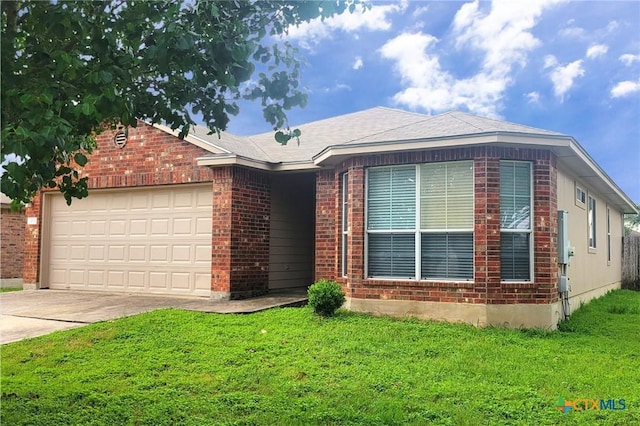 113 Altamont St, Hutto, TX 78634 - ranch-style home with concrete driveway, a front lawn, a garage, and brick siding