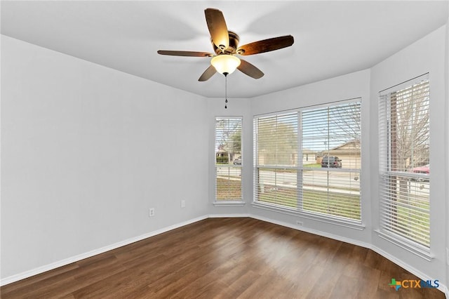 113 Altamont St, Hutto, TX 78634 - spare room featuring a ceiling fan, dark wood-style floors, and baseboards