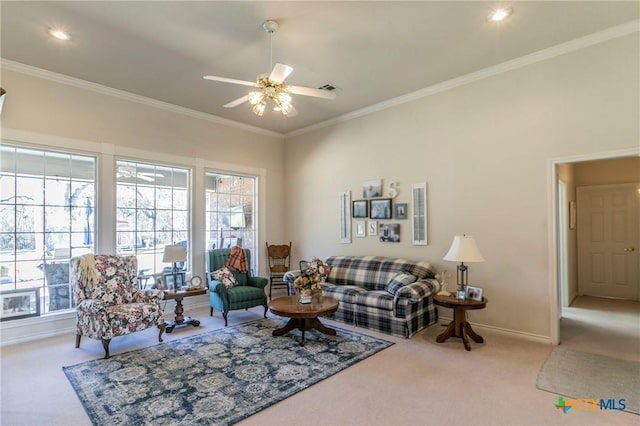 carpeted living room featuring crown molding and ceiling fan