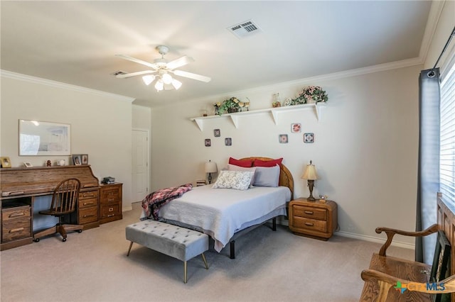 bedroom with crown molding, light colored carpet, and ceiling fan