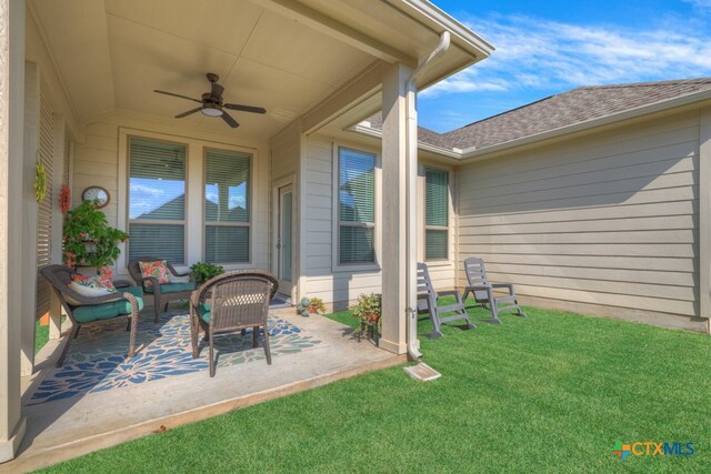 view of patio featuring ceiling fan