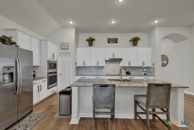 kitchen featuring white cabinetry, hardwood / wood-style floors, and stainless steel appliances