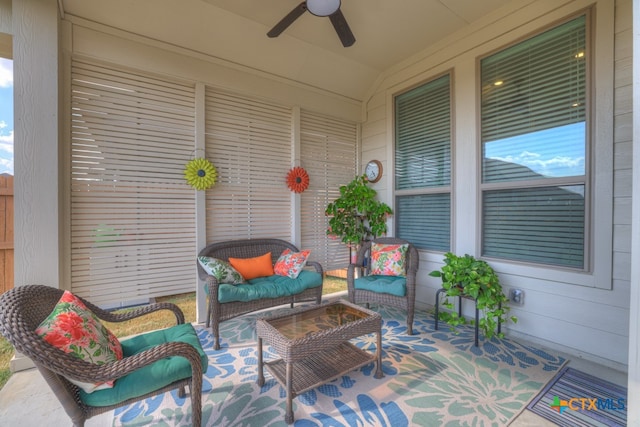 view of patio with ceiling fan and an outdoor living space