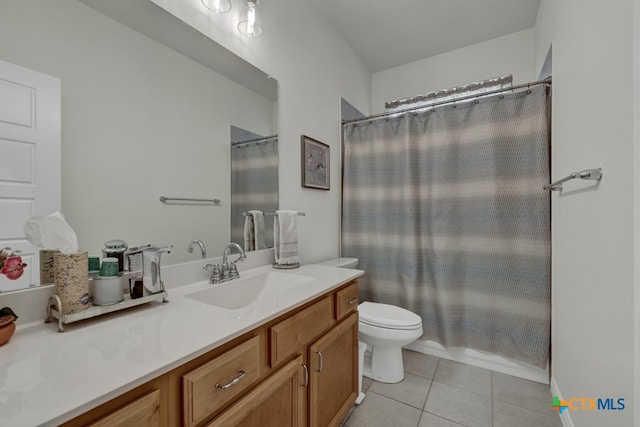 full bathroom with vanity, shower / tub combo with curtain, tile patterned floors, and toilet