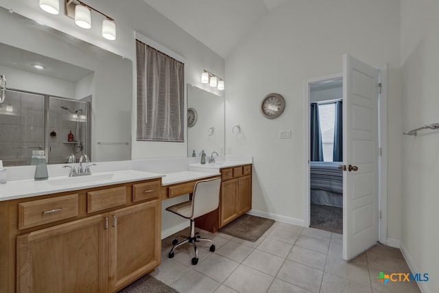 bathroom featuring vanity, walk in shower, tile patterned flooring, and vaulted ceiling