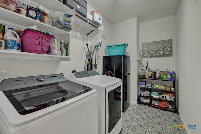 laundry area with separate washer and dryer