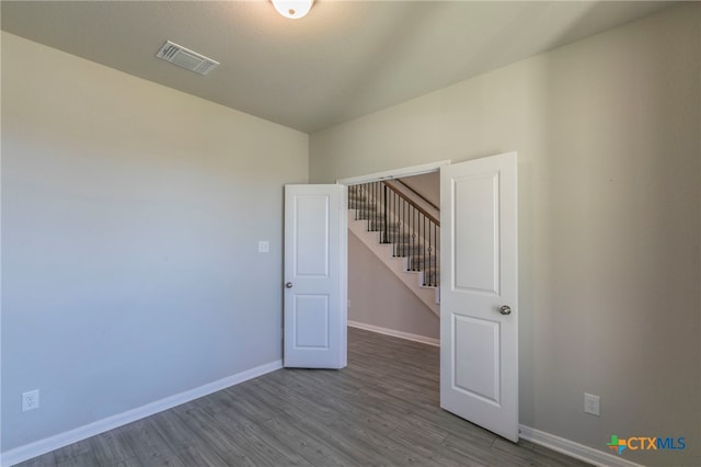 empty room featuring hardwood / wood-style floors