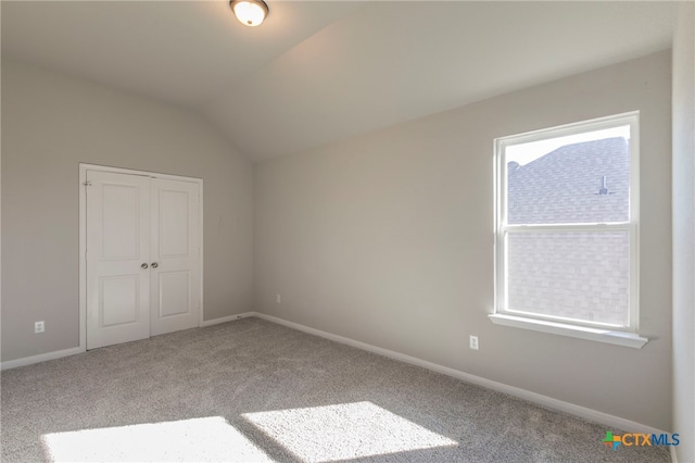 bonus room featuring carpet floors and vaulted ceiling