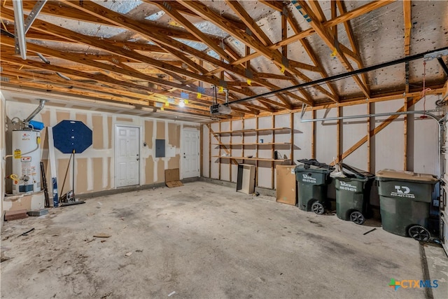 garage with water heater, a garage door opener, and electric panel