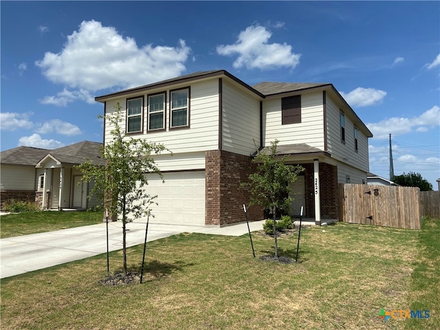 view of front facade featuring a garage and a front lawn