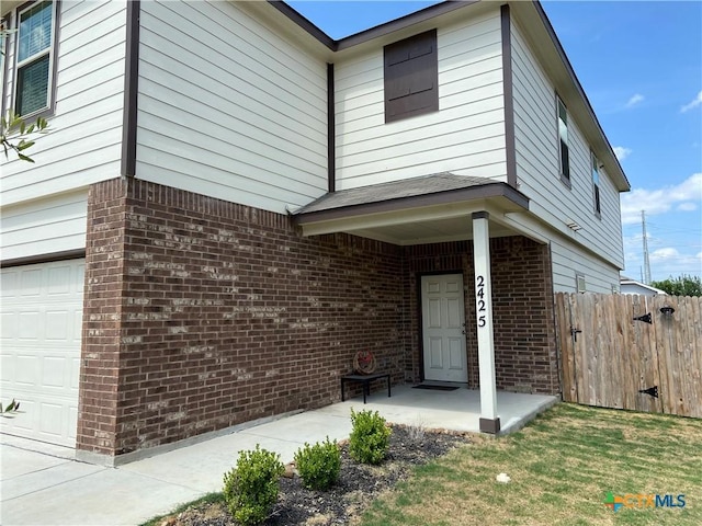 2425 Marty Way, Seguin, TX 78155 - view of front of property with brick siding and an attached garage