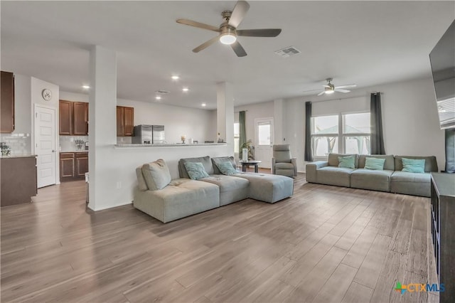 2425 Marty Way, Seguin, TX 78155 - living area with ceiling fan, wood finished floors, and recessed lighting