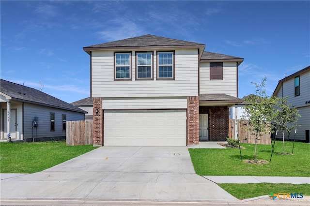 view of front property featuring a front lawn and a garage