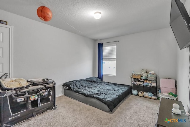 2425 Marty Way, Seguin, TX 78155 - carpeted bedroom with a textured ceiling