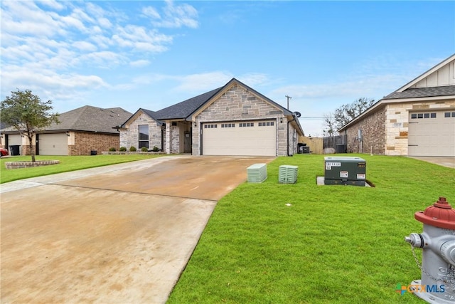 view of front of home with a garage and a front lawn