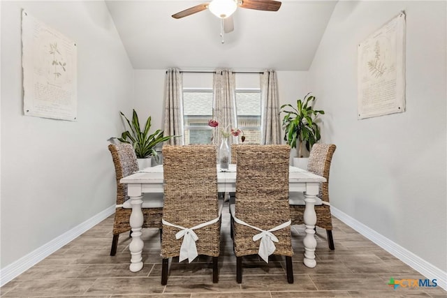 dining area with vaulted ceiling and ceiling fan