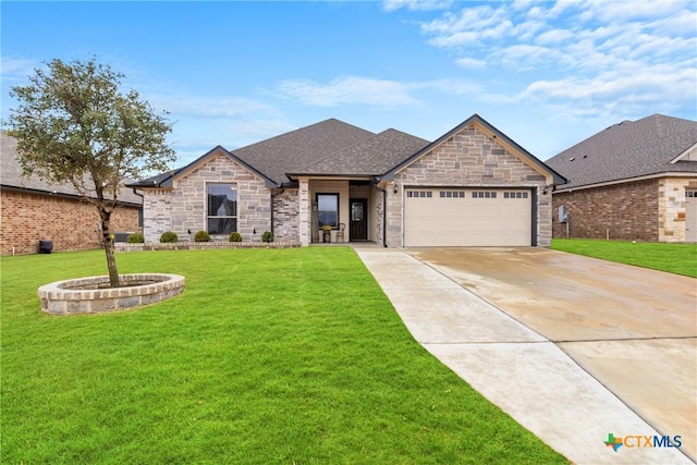 view of front of house featuring a garage and a front yard