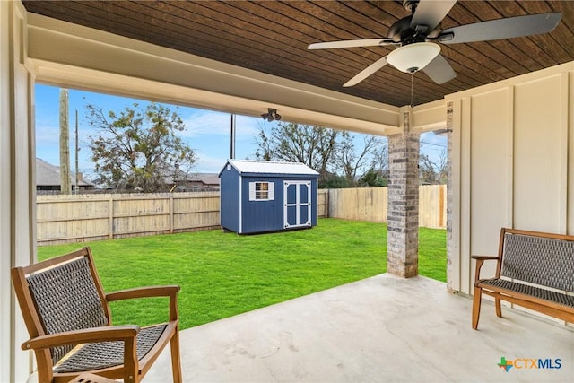 view of patio / terrace featuring ceiling fan and a storage shed