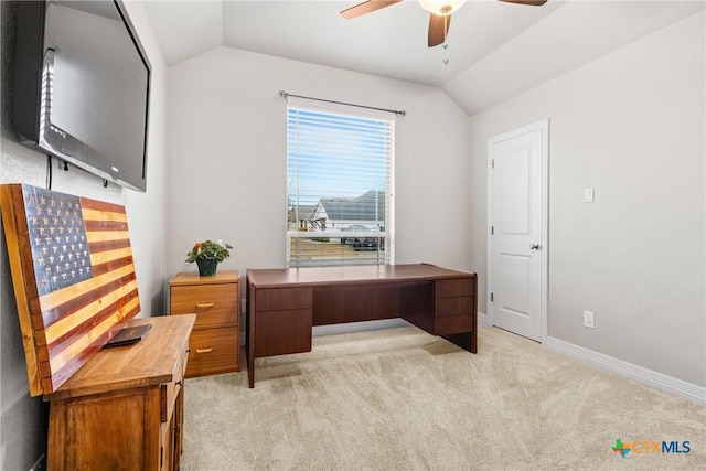 carpeted home office featuring vaulted ceiling and ceiling fan