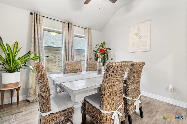 dining space with lofted ceiling and ceiling fan