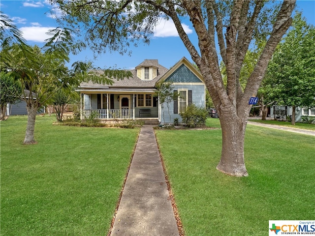 cape cod home featuring a porch and a front yard