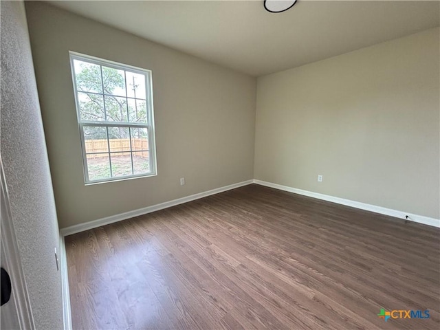 710 E 5th St, Nixon, TX 78140 - unfurnished room with plenty of natural light and dark wood-type flooring
