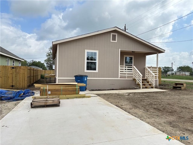 710 E 5th St, Nixon, TX 78140 - back of house with covered porch and a patio area