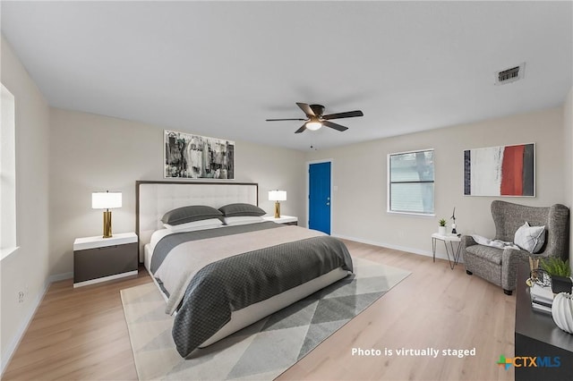 bedroom featuring ceiling fan and light hardwood / wood-style flooring