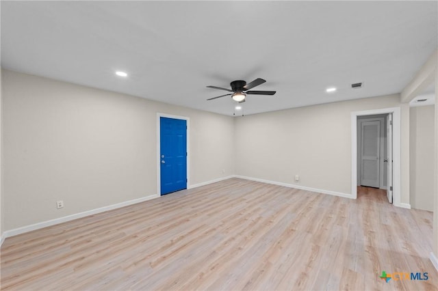 spare room with recessed lighting, light wood-type flooring, a ceiling fan, and baseboards