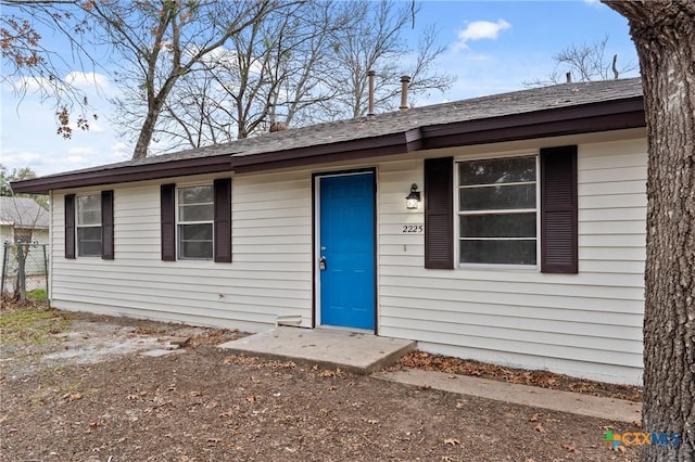 single story home with fence