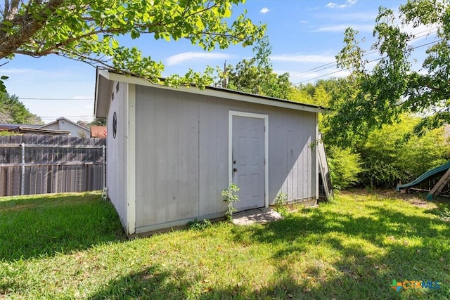 view of outdoor structure with a lawn