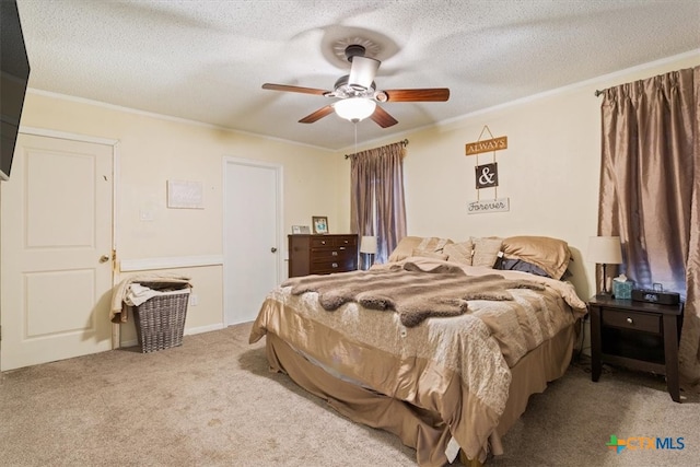 bedroom with ceiling fan, light carpet, a textured ceiling, and ornamental molding