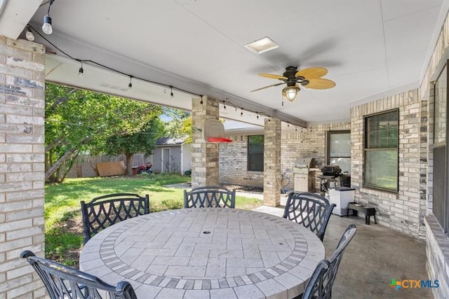 view of patio featuring ceiling fan