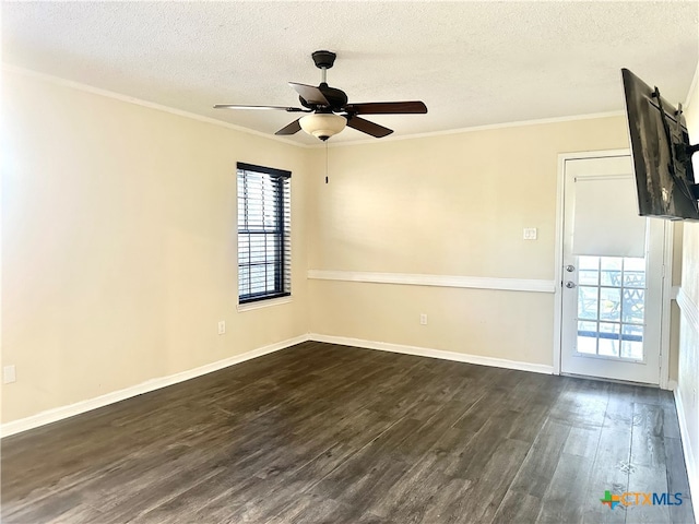 spare room with ornamental molding, a textured ceiling, ceiling fan, and dark wood-type flooring