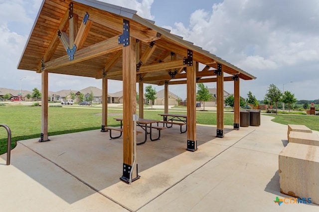 view of property's community with a gazebo, a yard, and a patio