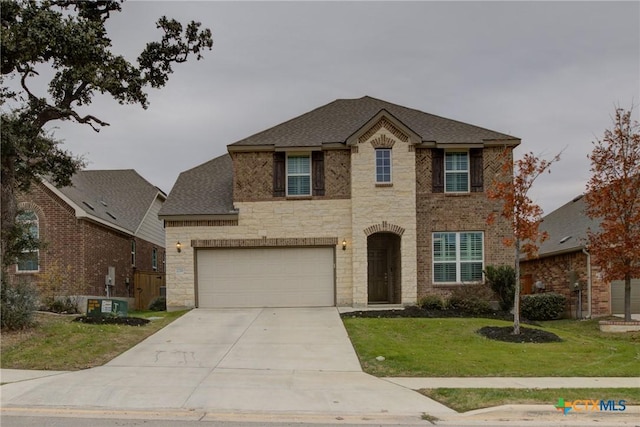 view of front facade with a front yard and a garage