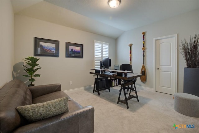 carpeted office with vaulted ceiling