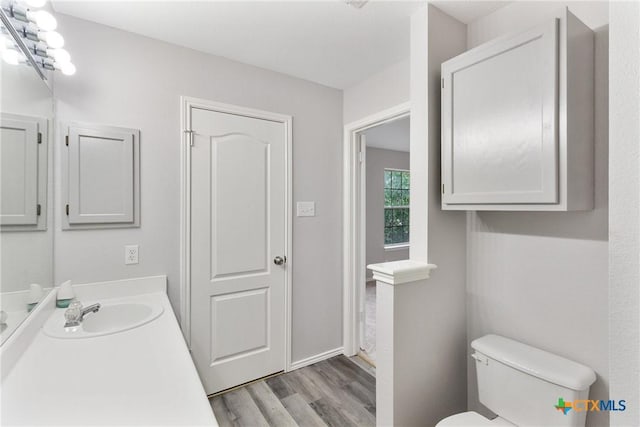 9538 Beau Brg, San Antonio, TX 78254 - bathroom featuring wood finished floors and vanity