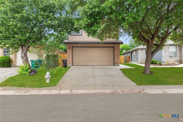 9538 Beau Brg, San Antonio, TX 78254 - view of property hidden behind natural elements featuring driveway, brick siding, and a garage